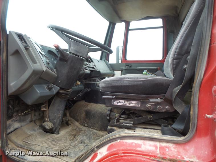 image for item DB2911 1990 Ford Cargo 8000 truck with New Holland 1060 bale stacker retriever