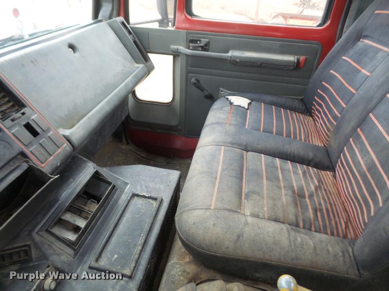 image for item DB2911 1990 Ford Cargo 8000 truck with New Holland 1060 bale stacker retriever