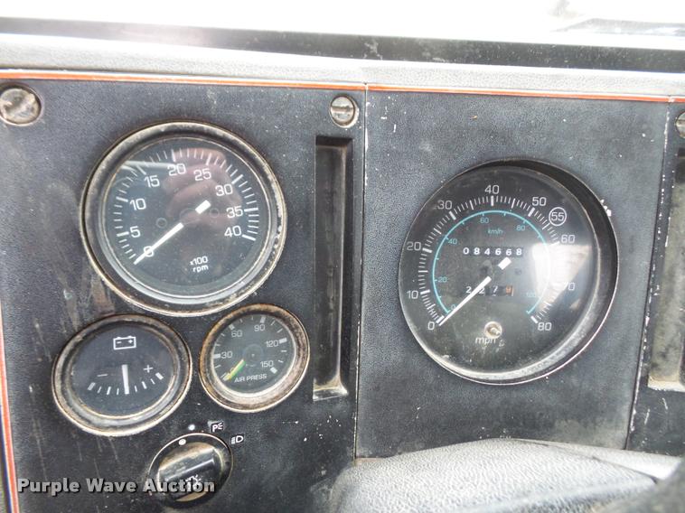 image for item DB2911 1990 Ford Cargo 8000 truck with New Holland 1060 bale stacker retriever