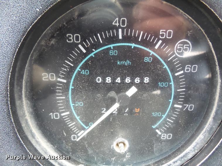 image for item DB2911 1990 Ford Cargo 8000 truck with New Holland 1060 bale stacker retriever