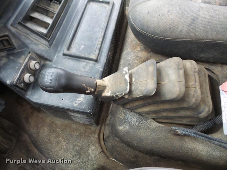 image for item DB2911 1990 Ford Cargo 8000 truck with New Holland 1060 bale stacker retriever