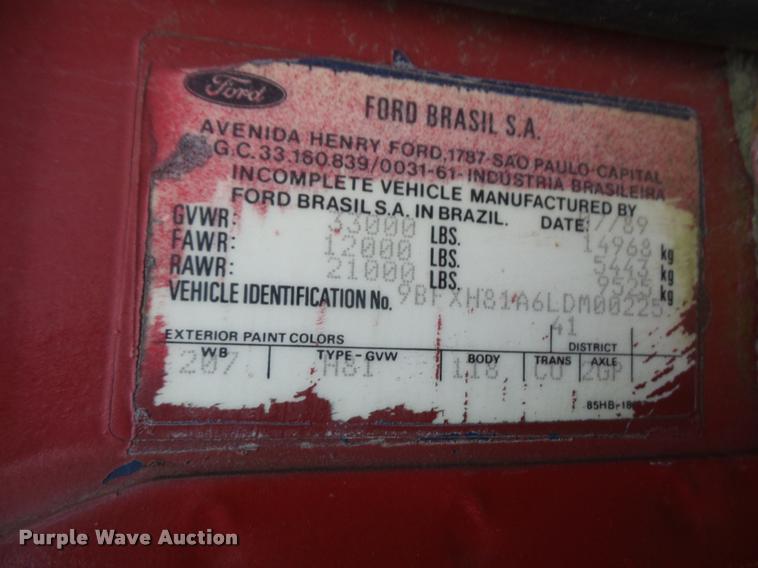 image for item DB2911 1990 Ford Cargo 8000 truck with New Holland 1060 bale stacker retriever