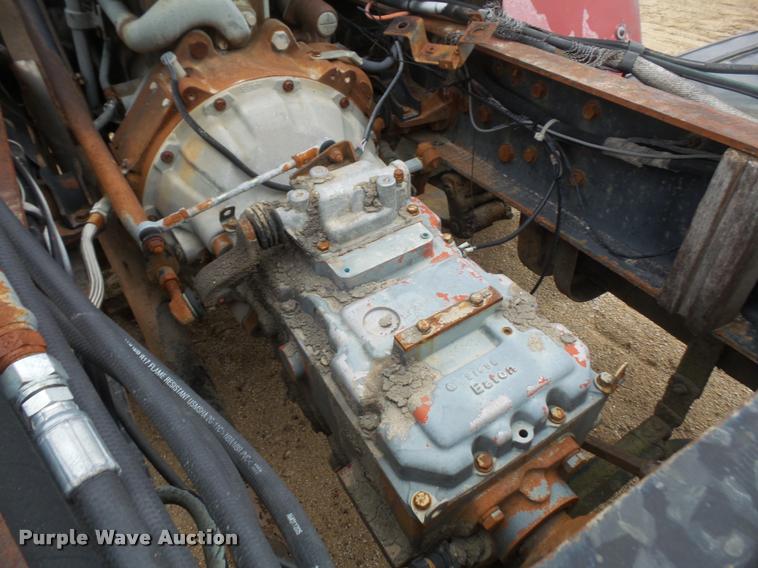 image for item DB2911 1990 Ford Cargo 8000 truck with New Holland 1060 bale stacker retriever