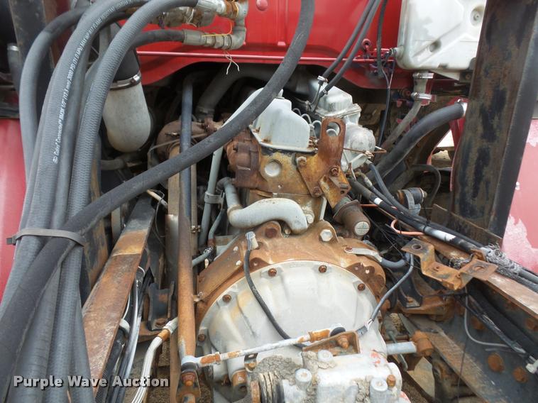 image for item DB2911 1990 Ford Cargo 8000 truck with New Holland 1060 bale stacker retriever