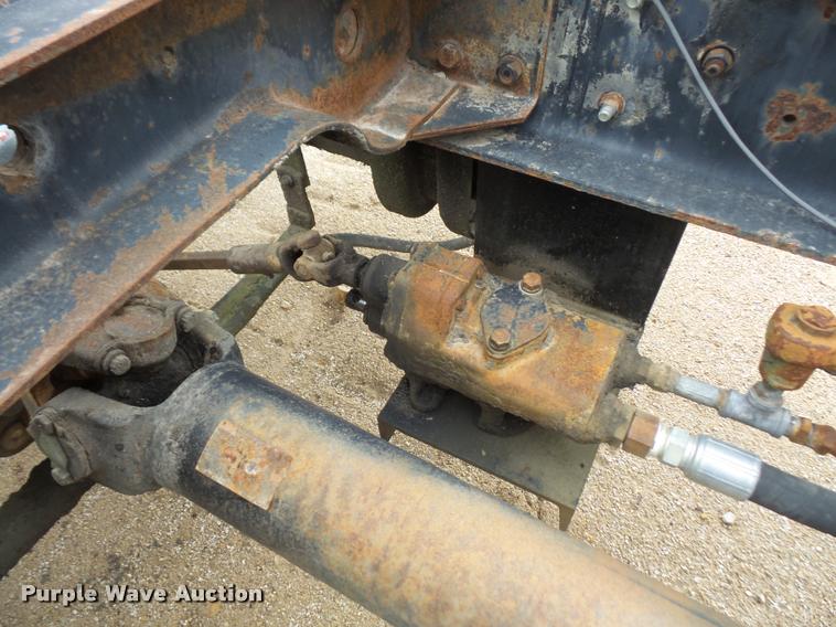 image for item DB2911 1990 Ford Cargo 8000 truck with New Holland 1060 bale stacker retriever