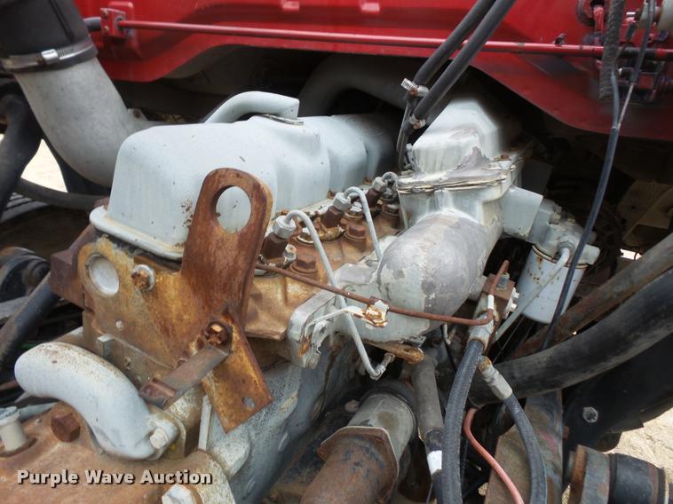 image for item DB2911 1990 Ford Cargo 8000 truck with New Holland 1060 bale stacker retriever