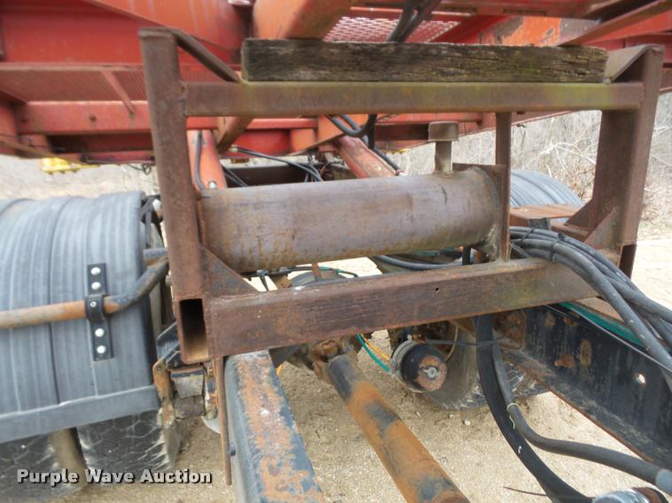 image for item DB2911 1990 Ford Cargo 8000 truck with New Holland 1060 bale stacker retriever