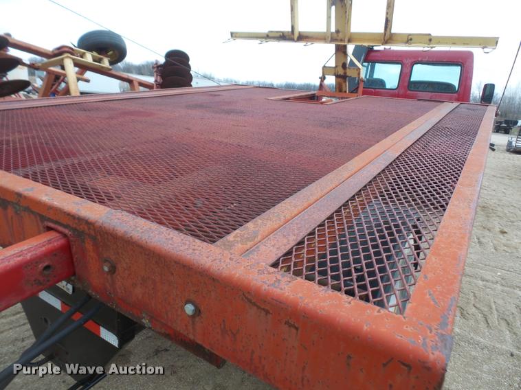 image for item DB2911 1990 Ford Cargo 8000 truck with New Holland 1060 bale stacker retriever