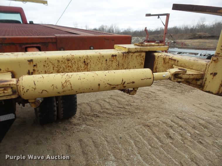 image for item DB2911 1990 Ford Cargo 8000 truck with New Holland 1060 bale stacker retriever