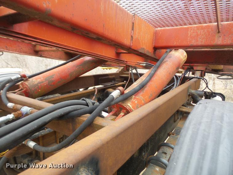 image for item DB2911 1990 Ford Cargo 8000 truck with New Holland 1060 bale stacker retriever