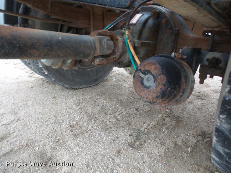 image for item DB2911 1990 Ford Cargo 8000 truck with New Holland 1060 bale stacker retriever