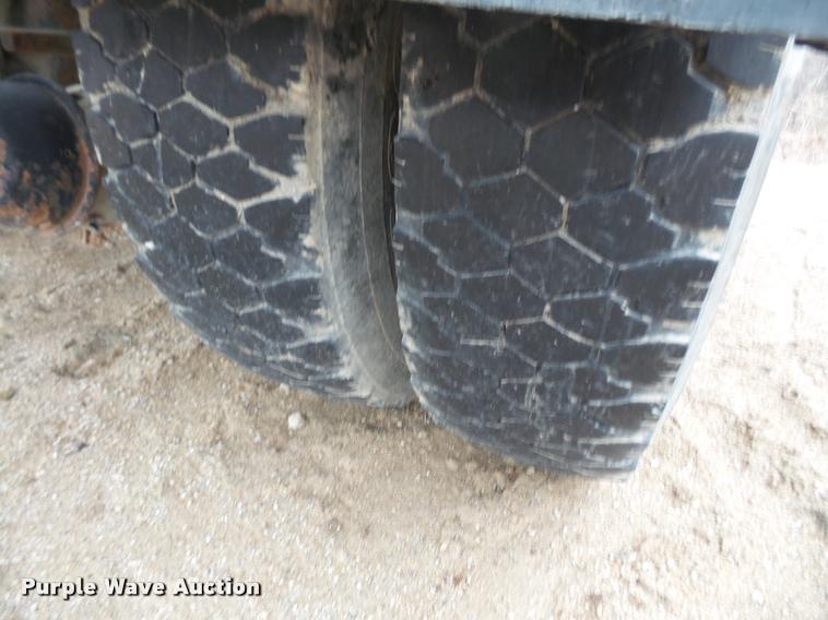 image for item DB2911 1990 Ford Cargo 8000 truck with New Holland 1060 bale stacker retriever