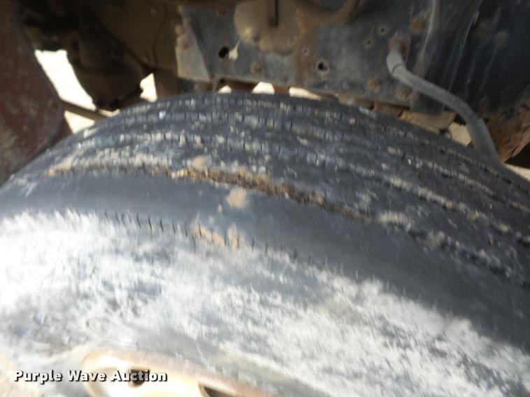 image for item DB2911 1990 Ford Cargo 8000 truck with New Holland 1060 bale stacker retriever