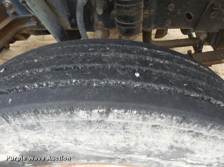 image for item DB2911 1990 Ford Cargo 8000 truck with New Holland 1060 bale stacker retriever