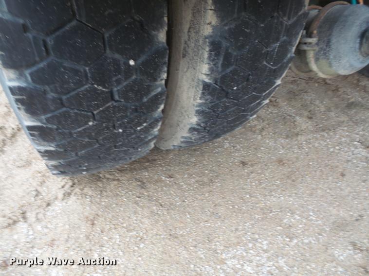 image for item DB2911 1990 Ford Cargo 8000 truck with New Holland 1060 bale stacker retriever