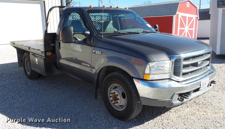 image for item DA2566 2004 Ford F350 Super Duty XLT flatbed pickup truck