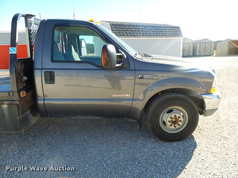image for item DA2566 2004 Ford F350 Super Duty XLT flatbed pickup truck