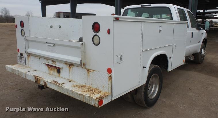 image for item DB0677 2007 Ford F350 Super Duty Crew Cab utility bed pickup truck