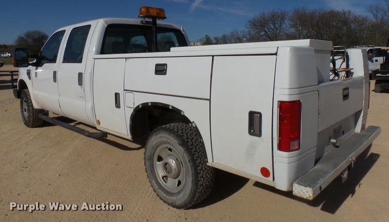 image for item DB2457 2008 Ford F350 Super Duty XL Crew Cab utility bed pickup truck