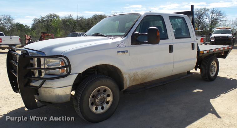 image for item DB2458 2007 Ford F250 Super Duty Crew Cab flatbed pickup truck