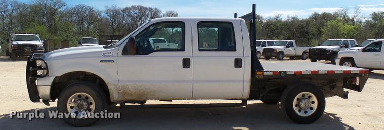 image for item DB2458 2007 Ford F250 Super Duty Crew Cab flatbed pickup truck