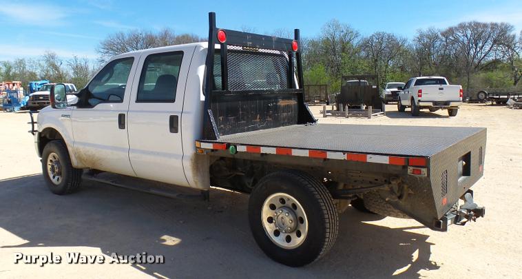 image for item DB2458 2007 Ford F250 Super Duty Crew Cab flatbed pickup truck
