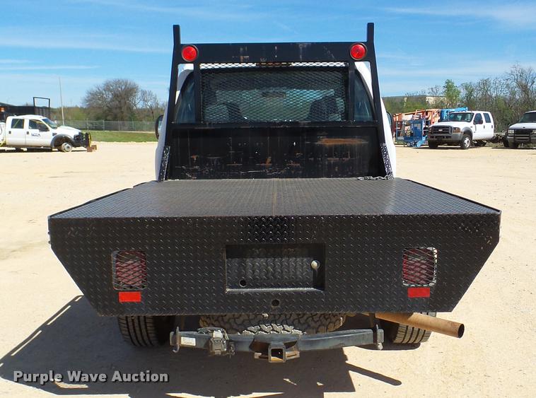 image for item DB2458 2007 Ford F250 Super Duty Crew Cab flatbed pickup truck