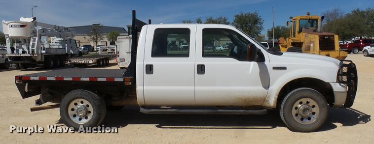 image for item DB2458 2007 Ford F250 Super Duty Crew Cab flatbed pickup truck