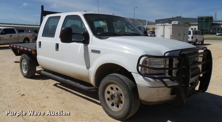 image for item DB2458 2007 Ford F250 Super Duty Crew Cab flatbed pickup truck