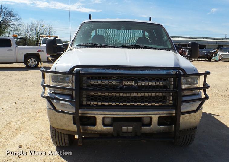 image for item DB2458 2007 Ford F250 Super Duty Crew Cab flatbed pickup truck
