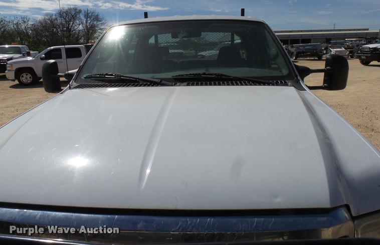 image for item DB2458 2007 Ford F250 Super Duty Crew Cab flatbed pickup truck