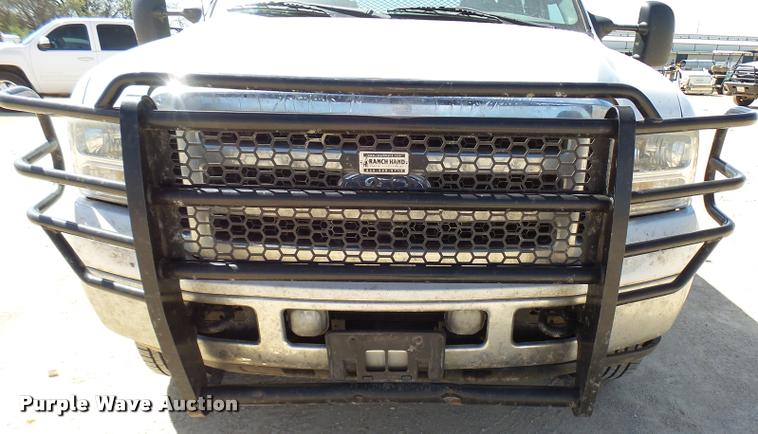 image for item DB2458 2007 Ford F250 Super Duty Crew Cab flatbed pickup truck