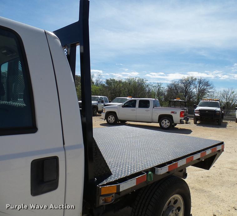 image for item DB2458 2007 Ford F250 Super Duty Crew Cab flatbed pickup truck