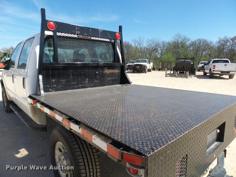image for item DB2458 2007 Ford F250 Super Duty Crew Cab flatbed pickup truck