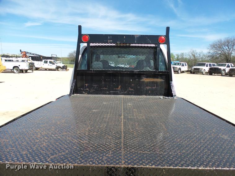 image for item DB2458 2007 Ford F250 Super Duty Crew Cab flatbed pickup truck