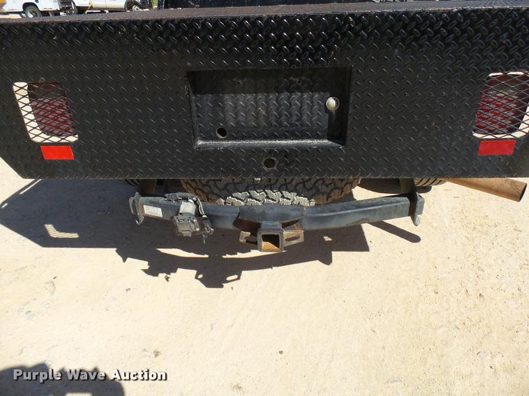 image for item DB2458 2007 Ford F250 Super Duty Crew Cab flatbed pickup truck