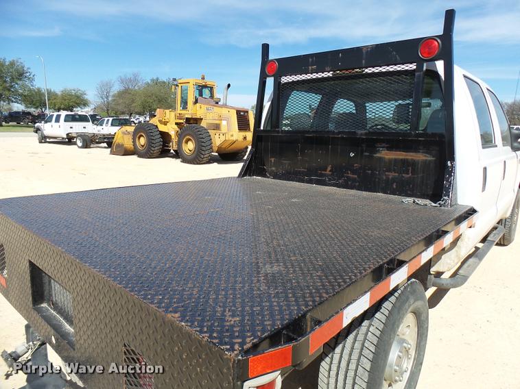 image for item DB2458 2007 Ford F250 Super Duty Crew Cab flatbed pickup truck