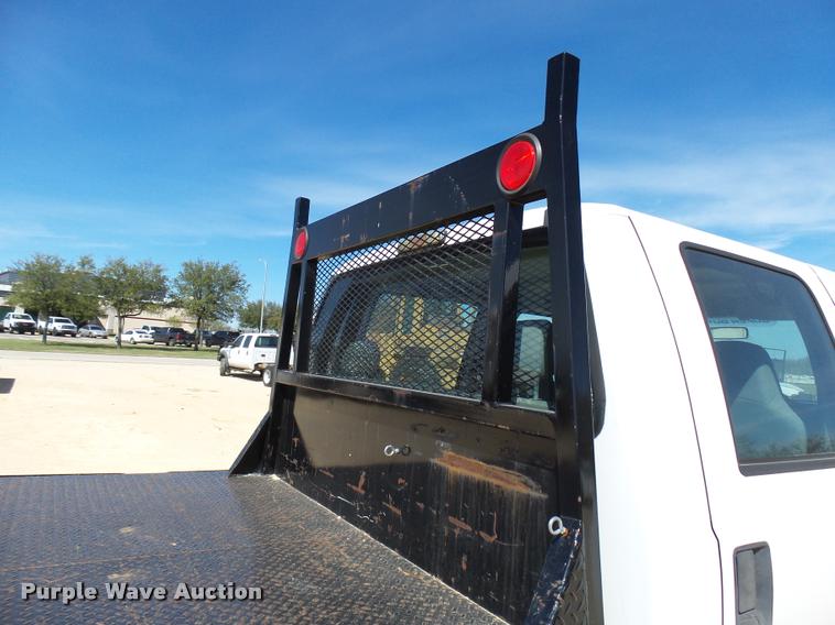 image for item DB2458 2007 Ford F250 Super Duty Crew Cab flatbed pickup truck