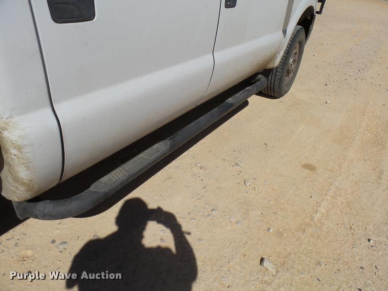 image for item DB2458 2007 Ford F250 Super Duty Crew Cab flatbed pickup truck