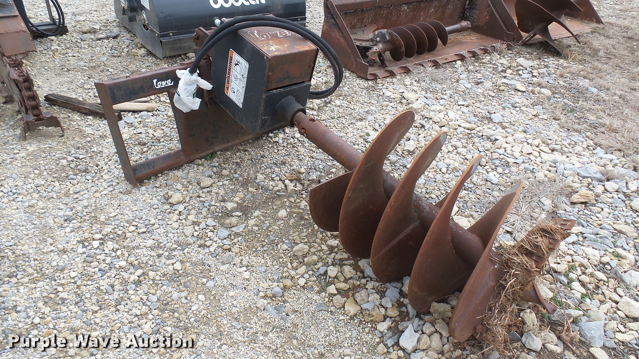 Lowe skid steer auger in Benton, KS Item CB9580 sold Purple Wave