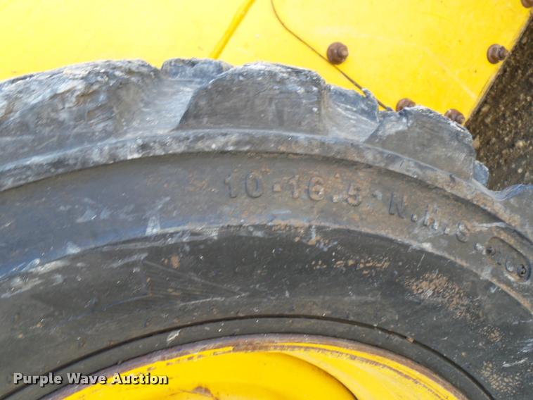 image for item J1581 1999 John Deere 240 skid steer