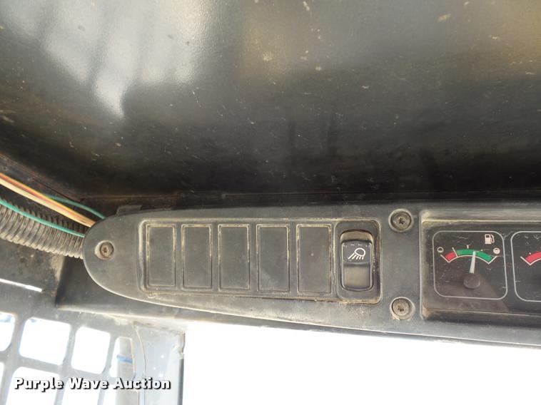 image for item J1581 1999 John Deere 240 skid steer