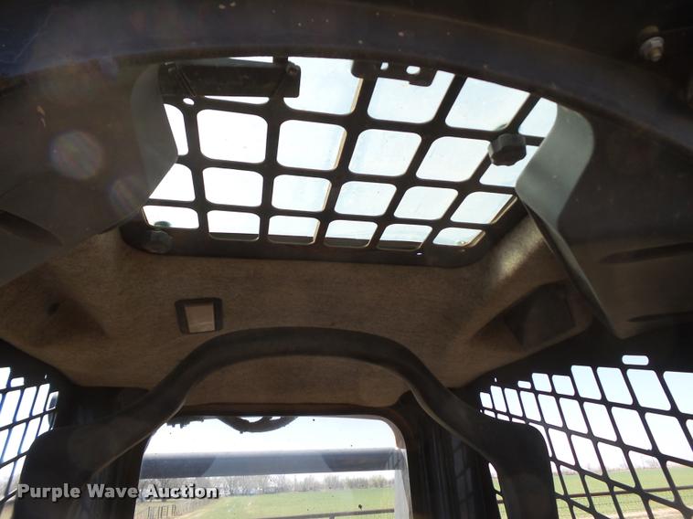 image for item L1616 2010 John Deere 319D skid steer