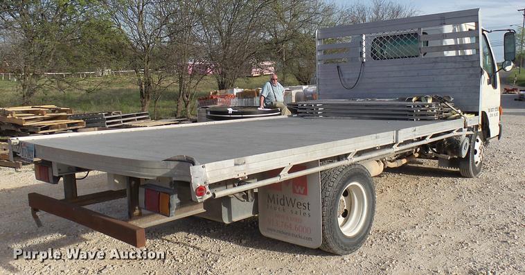 image for item DB2463 2004 Isuzu NPR flatbed truck