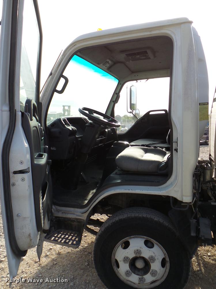 image for item DB2463 2004 Isuzu NPR flatbed truck