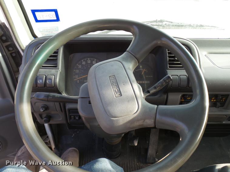 image for item DB2463 2004 Isuzu NPR flatbed truck