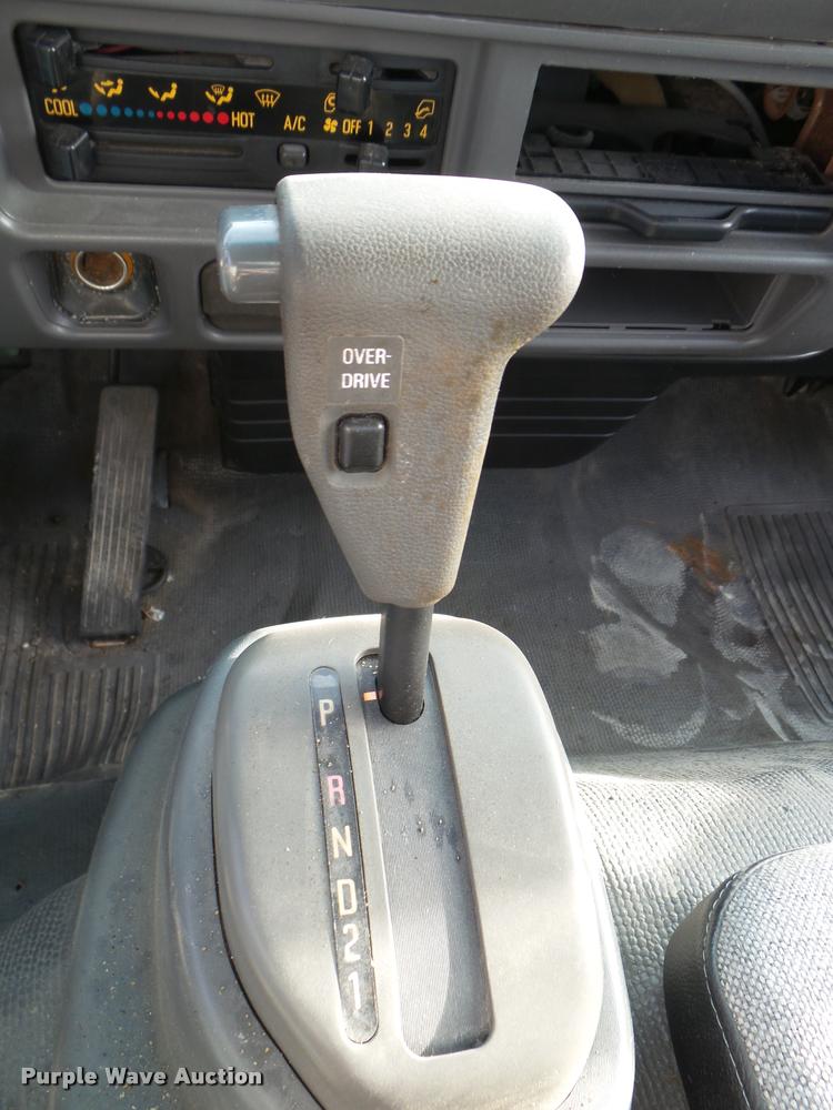 image for item DB2463 2004 Isuzu NPR flatbed truck