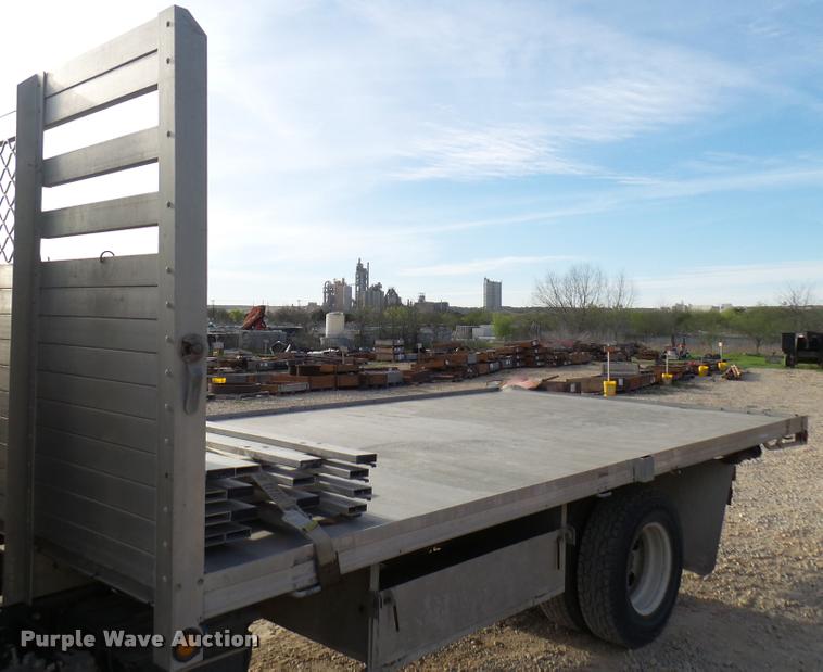 image for item DB2463 2004 Isuzu NPR flatbed truck