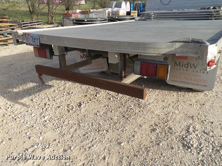 image for item DB2463 2004 Isuzu NPR flatbed truck