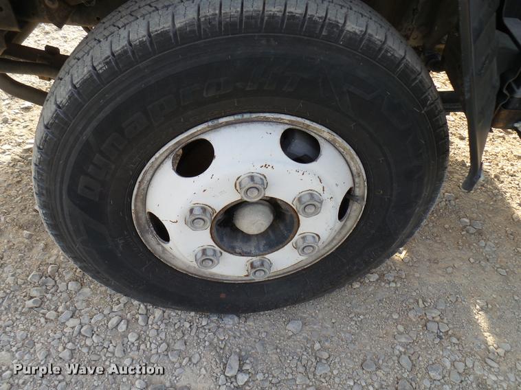 image for item DB2463 2004 Isuzu NPR flatbed truck